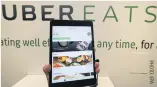  ??  ?? LEFT The UberEats applicatio­n is displayed on a tablet in Seoul.