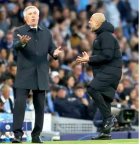  ?? AFP/VNA Photo ?? REAL DEAL: Pep Guardiola, the head coach of Manchester City reacts during the UEFA Champions League semifinal first leg match between Manchester City and Real Madrid at City of Manchester Stadium on April 26 in Manchester, England. The two teams will play the second leg match today.