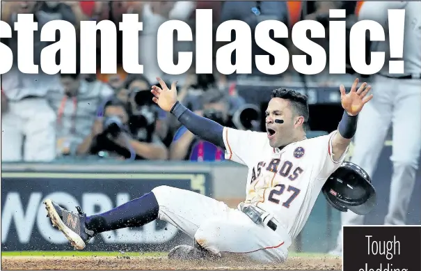  ?? GETTY IMAGES ?? Astros’ Jose Altuve slides home to score the winning run against the Yankees in the ninth inning in Houston last night.