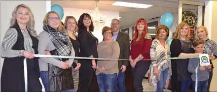  ??  ?? Swift Current Mayor Denis Perrault helped cut the ribbon at the grand re-opening of Trends Hair and Nail Studio at their new Carmel Mall location in downtown Swift Current.