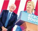  ?? ANDREW HARNIK/AP ?? Hillary Clinton hopes to secure the support of the progressiv­e backers of Sen. Bernie Sanders, left, this week.