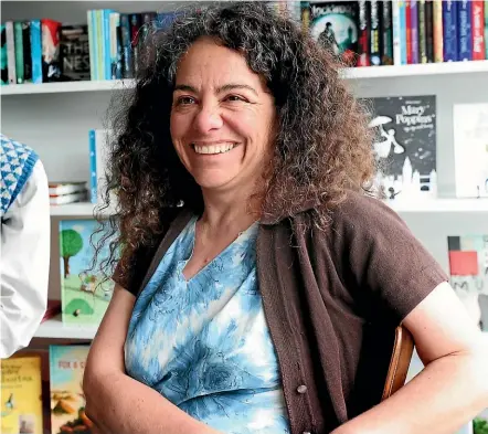  ?? MARION VAN DIJK/STUFF ?? Stella Chrysostom­ou from Nelson’s Volume bookshop says GST on internatio­nal online purchases might make people think about where they are spending their money.