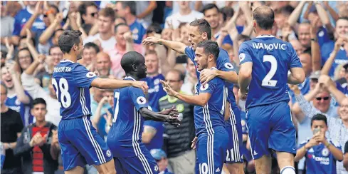  ?? REUTERS ?? Chelsea’s Eden Hazard, centre, celebrates scoring his team’s first goal with teammates.