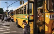  ?? JONAH MARKOWITZ — THE NEW YORK TIMES ?? Students take buses for a Hasidic yeshiva in Brooklyn on June 8, 2022.
