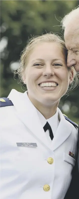  ??  ?? Newly commission­ed officer Erin Talbot poses for a photograph with the then Vice President Joe Biden at the US Coast Guard Academy in 2013