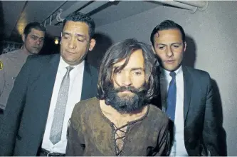  ?? THE ASSOCIATED PRESS FILES ?? In this 1969 photo, Charles Manson is escorted to court in connection with the Sharon Tate murder case. Authoritie­s say Manson died on Sunday at 83 years old.