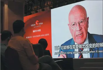  ?? WANG ZHUANGFEI / CHINA DAILY ?? Audience members listen to a speech by British Sinologist Martin Jacques via video at the Vision China event in Jiaxing, Zhejiang province, on Sunday.