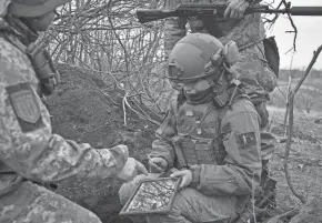  ?? ?? Soldiers of the Ukrainian Volunteer Army hold their positions at the front line near Bakhmut, Donetsk region, on Saturday.