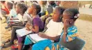  ?? /Reuters ?? For the mind: Children learn at an evening school in Dakar, Senegal.