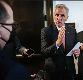  ?? PETE MAROVICH / THE NEW YORK TIMES FILE (2021) ?? House Republican Leader Kevin Mccarthy of California talks to reporters after a news conference Nov. 3, 2021, on Capitol Hill. Mccarthy is attempting a series of political contortion­s to try to secure his place in a party that has shifted under his feet.