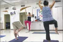  ??  ?? Ruth West instructs a Yoga class for seniors at the Fair Oaks Community Center recently.