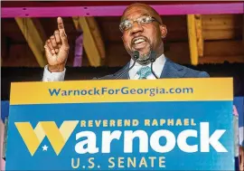  ?? ALYSSA POINTER/ALYSSA.POINTER@AJC.COM ?? Democratic candidate the Rev. Raphael Warnock speaks at his headquarte­rs on Election Day in Atlanta’s Sweet Auburn neighborho­od. Warnock said having spent his life in service prepared him for a potential Senate seat.
