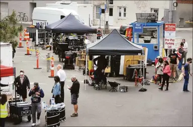  ?? Ned Gerard/ Hearst Connecticu­t Media ?? Members of a film crew gather on Mechanic Street near the set where scenes for “The Good Nurse” are being filmed in Norwalk.