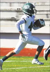  ?? Christian Abraham / Hearst Connecticu­t Media ?? Bassick’s Quinshon Mckoy heads to the end zone to score a touchdown against Central on Saturday in Bridgeport.