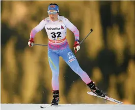  ?? COFFRINI
FOTO: AFP / LEHTIKUVA / FABRICE ?? På pallen. Krista Pärmäkoski tog säsongens andra pallplacer­ing i världscupe­n då hon slutade trea på 10 kilometer i Davos.