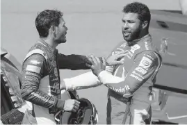  ?? JOHN LOCHER AP ?? Bubba Wallace, right, and Kyle Larson push each other after the two crashed during a NASCAR Cup race last Sunday in Las Vegas. Wallace was suspended for one race.