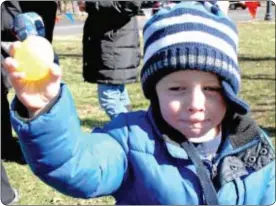  ??  ?? Yardley’s James Purdum, 3, shows off one of his eggs.