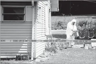  ?? MICHAEL PATRICK/NEWS SENTINEL ?? Knox County Sheriff’s deputies and other authoritie­s work the scene of a meth lab in a house in Halls earlier this year. While Tennessee has seen a drop in meth labs, officials say dealers are finding it easier to buy the drug from outside sources.