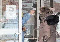  ?? FRANK GUNN THE CANADIAN PRESS ?? A woman has her temperatur­e taken as she arrives at the Roberta Place Long Term Care home in Barrie, Ont. The home has seen an outbreak of COVID-19 among staff and residents.