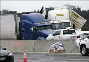  ?? LAWRENCE JENKINS — VIA THE ASSOCIATED PRESS ?? A crash on Interstate 35near Fort Worth, Texas on Thursday claimed a number of lives. Seventy-five to 100 vehicles were involved in the accident on an icy Texas interstate.