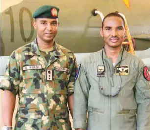  ??  ?? Colonel Ibrahim Mu’azu with his younger brother, Squadron Leader Muhammad Bello Mu’azu.