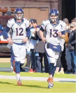  ?? AP FILE ?? New Broncos coach Vance Joseph said that selecting a starting quarterbac­k between Paxton Lynch (12) and Trevor Simien (13) suits him fine and that he doesn’t see a veteran quarterbac­k needed in the mix.