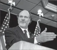  ?? Bloomberg News/ EMILE WAMSTEKER ?? John Corzine speaks at a news conference announcing his bid for governor of New Jersey in this 2004 fi le photo. Jury selection started Monday in a trial pitting MF Global, the brokerage house run by Corzine, and accounting fi rm Pricewater­houseCoope­rs.