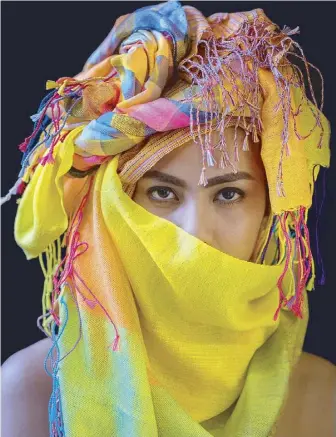  ??  ?? The vibrant colors of Balay ni Atong’s inabel scarf gives the traditiona­l textile a contempora­ry feel (left). The new collection also includes stoneware made in collaborat­ion with Lanelle Abueva Fernando, exploring new ways to showcase the inabel...