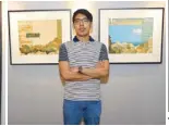  ??  ?? Mik Santos with his artwork, “Teal” that captures the graphic sensibilit­y in his works.