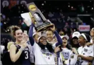  ?? TONY DEJAK — THE ASSOCIATED PRESS FILE ?? In this Sunday file photo, Notre Dame’s Arike Ogunbowale holds the trophy after defeating Mississipp­i State 61-58in the final of the women’s NCAA Final Four college basketball tournament, in Columbus, Ohio. Ogunbowale is scheduled to make an appearance...