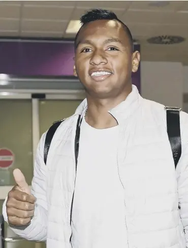  ??  ?? 0 Colombian striker Alfredo Morelos arrives at Edinburgh Airport ahead of his move to Rangers.