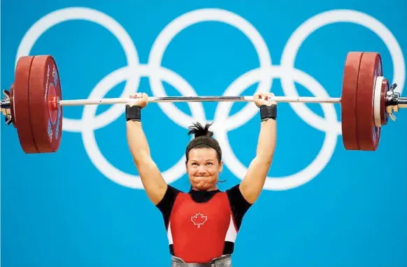  ??  ?? Initialeme­nt médaillée de bronze aux Jeux de Londres, l’haltérophi­le Christine Girard est maintenant officielle­ment championne de la catégorie des 63 kilos après que les deux autres médaillées ont été disqualifi­ées pour dopage.