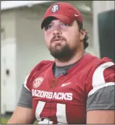  ?? Special to The Sentinel-Record/Craven Whitlow ?? RAZORBACK STAR: Arkansas junior defensive lineman Austin Capps, from Star City, takes questions on Aug. 4 from reporters at the team’s media day. Capps recently switched from the defensive line to the offensive line.