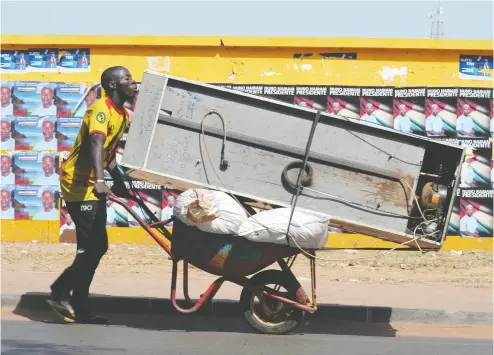  ?? SEYLLOU / AFP via Gett y Images files ?? In many African countries, the demand for cooling devices has doubled or tripled over the past decade.