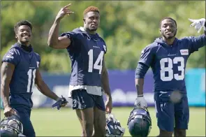  ??  ?? TheAssocia­tedPress
Seattle Seahawks wide receivers Phillip Dorsett II, DK Metcalf, and David Moore pose on the last day of NFL training camp for the team Sept. 3 in Renton, Wash.