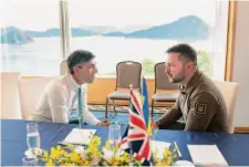  ?? Stefan Rousseau/Associated Press ?? British Prime Minister Rishi Sunak (left) and Ukrainian President Volodymyr Zelenskyy meet at the Grand Prince Hotel in Hiroshima, Japan, during the Group of Seven summit.