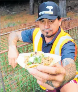  ?? PICTURE / NRC ?? Northland Regional Council biosecurit­y officer Warren Morunga with a wild pork roll similar to those the council plans to give away this week.