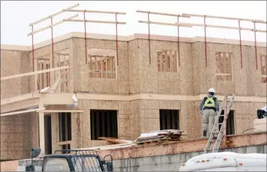  ?? Daily Courier file photo ?? Less of this is expected to happen in Kelowna over the next two years as new home constructi­on and home sales slow, prices soften and mortgage interest rates rise.