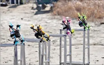  ?? AFP ?? Drones taking flight during a drone-racing training session at a rice field in Hwaseong, south of Seoul.