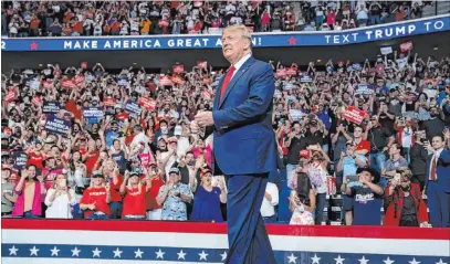  ?? The Associated Press file ?? President Donald Trump arrives onstage to speak at a campaign rally June 20 at the BOK Center in Tulsa, Okla. Trump called off public components of the GOP convention in Florida, but delegates are scheduled to gather in Charlotte, N.C., on Aug. 24.