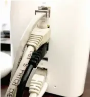  ??  ?? The Ethernet jacks on an Airport Extreme Base Station have green LED status lights next to them.