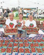  ?? MICHAEL SEARS / MILWAUKEE JOURNAL SENTINEL ?? Strawberri­es are the star of the show at the annual Strawberry Festival in Cedarburg, held every June.