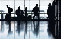  ??  ?? Travelers making their way through Norman Y. Mineta San Jose Internatio­nal Airport in San Jose on June 25.