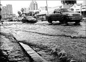  ?? LYNNE SLADKY/AP 2014 ?? Neighborho­ods in Miami Beach, Fla., have flooded during heavy rains and extreme high tides in recent years.