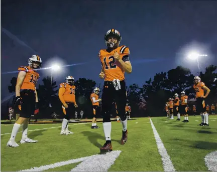  ?? KARL MONDON — STAFF PHOTOGRAPH­ER ?? Football returns for the first time since the start of the pandemic as Tristan Hofmann is introduced at Half Moon Bay before a game against Burlingame.