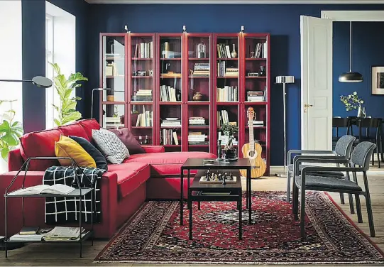  ??  ?? A row of three red bookcases creates a colourful backdrop and offers much-needed storage in a family room. Billy Bookcase with Glass Doors, $199 each, IKEA.com.
