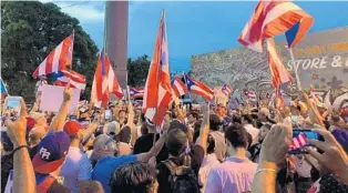  ?? ANDREW BORYGA/SOUTH FLORIDA SUN SENTINEL ?? A group of approximat­ely 300 Puerto Ricans gathered in Wynwood, Miami, on Monday to protest in solidarity with larger protests to oust Puerto Rico Governor Ricardo Rosselló on the island.