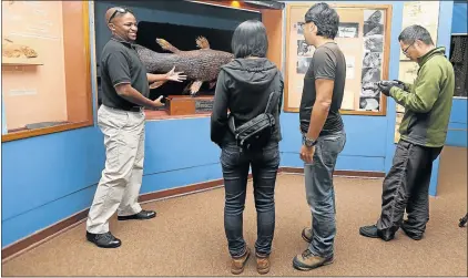  ?? Picture: FILE ?? SHOWCASING PROVINCE: Top tour guide, Velile Ndlumbini, owner of Imonti Tours, shows tourists around the East London Museum