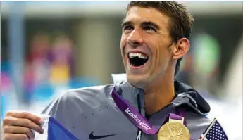  ??  ?? MICHEAL PHELPS the greatest Olympian of all time with 23 gold medals was so addicted to swimming that for five years he was said to have never missed a day of practice including Sundays