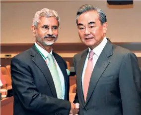  ??  ?? EXTERNAL AFFAIRS MINISTER S. Jaishankar with his Chinese counterpar­t Wang Yi during a meeting in New York in September 2019.